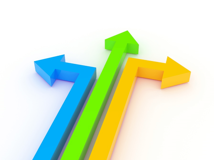 Stock image of multi-colored arrows travelling in a line together before diverging.