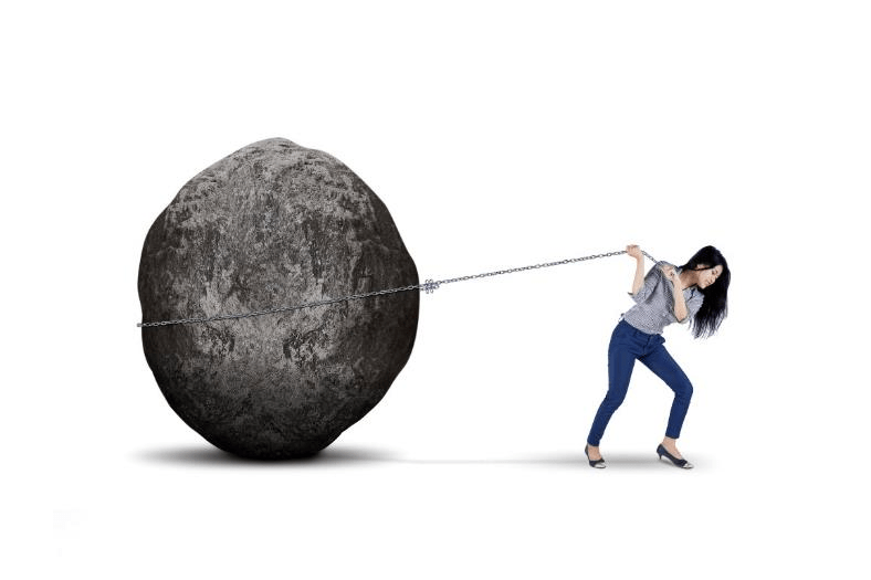 Stock image of a person pulling a boulder.