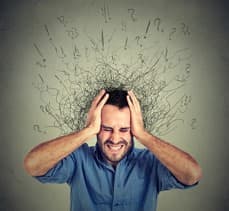 The image contains a picture of a man appearing to be overwhelmed.