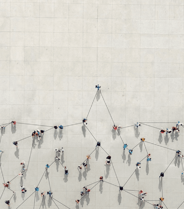 Stock image of a hierarchy mapped out over a birds eye view of people.