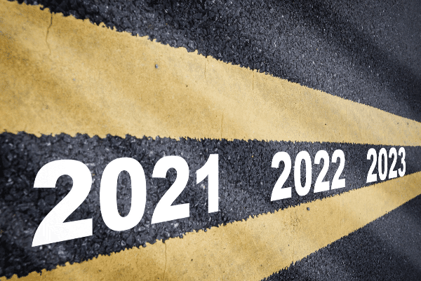 Stock photo of median lines on a road with the years 2021-2023 painted between them.