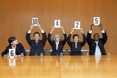Stock photo of judges holding up their ratings.
